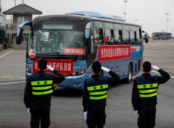 (200329) -- CHONGQING, March 29, 2020 -- The ground crew salute to medical workers supporting virus-hit Hubei Province as they arrive at Chongqing Jiangbei International Airport in southwest China s Chongqing, March 29, 2020. The last batch of medical assistance teams from Chongqing, which consists of 313 members, returned from Hubei as the epidemic outbreak in the hard-hit province has been subdued. (Photo by Xinhua) CHINA-CHONGQING-MEDICAL TEAM-RETURN FROM HUBEI (CN) HuangxWei 