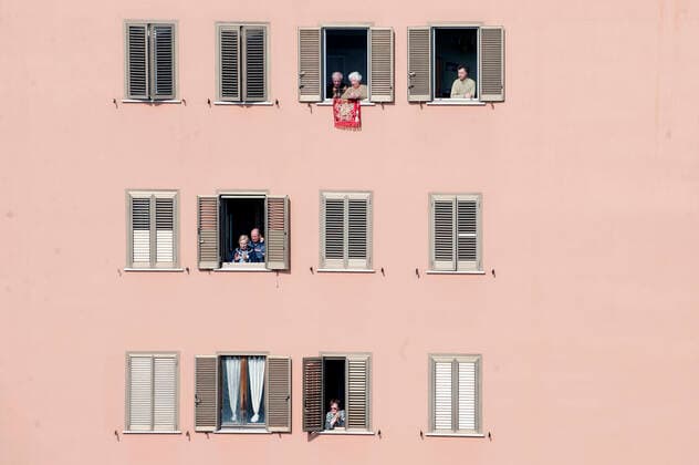 NO FRANCE - NO SWITZERLAND: March 29, 2020 : faithful listens, from the window home, priests celebrating the Sunday Holy Mass from the roof of the church San Gabriele dell Addolorata in Rome  Copyright: x& xa9;AlessiaxGiuliani CPPx xIPAx x& xa9;CatholicxPressxPhotox