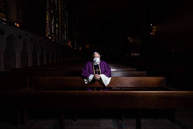 Paris, France, March 29, 2020 - Father Stephane Biaggi prays inside Sainte Odile church after celebrating a mass by videoconference during the Covid-19 epidemic.  Copyright: xAlexisxSciardx
