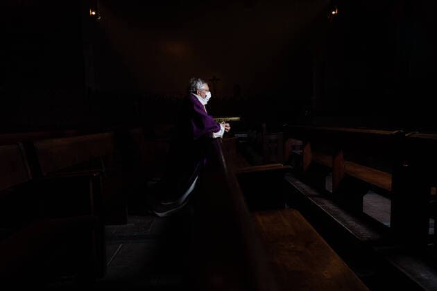 Paris, France, March 29, 2020 - Father Stephane Biaggi prays inside Sainte Odile church after celebrating a mass by videoconference during the Covid-19 epidemic.  Copyright: xAlexisxSciardx