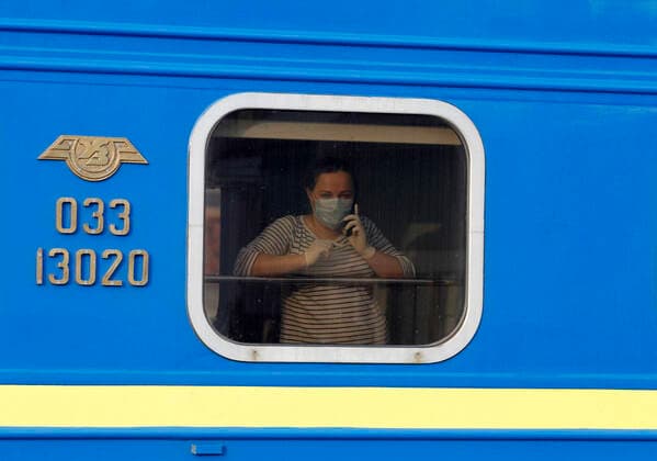 March 29, 2020, Kiev, Ukraine: A Ukrainian woman wearing a face mask as a preventive measure on a train after the evacuation..The special train from Kiev to Moscow evacuated Russian citizens to Moscow on 27 March 2020, and brought back Ukrainian citizens from Moscow to Kiev on 29 March 2020, after Ukrainian authorities shut the country s borders amid the spread of the COVID-19 coronavirus pandemic. Kiev Ukraine - ZUMAs197 20200329_zaa_s197_073 Copyright: xPavloxGoncharx
