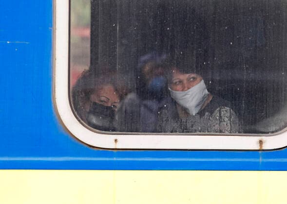 March 29, 2020, Kiev, Ukraine: A Ukrainian woman wearing a face mask as a preventive measure on a train after the evacuation..The special train from Kiev to Moscow evacuated Russian citizens to Moscow on 27 March 2020, and brought back Ukrainian citizens from Moscow to Kiev on 29 March 2020, after Ukrainian authorities shut the country s borders amid the spread of the COVID-19 coronavirus pandemic. Kiev Ukraine - ZUMAs197 20200329_zaa_s197_079 Copyright: xPavloxGoncharx