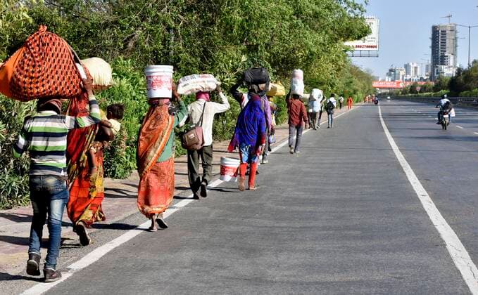 NEW DELHI, INDIA - MARCH 29: Migrant workers head home on Day 5 of the 21 day nationwide lockdown imposed by PM Narendra Modi to curb the spread of coronavirus, at Greater Noida Expressway, on March 29, 2020 in New Delhi, India. (Photo by Mohd Zakir Hindustan Times ) Migrant Workers Head Home In Coronavirus Lockdown