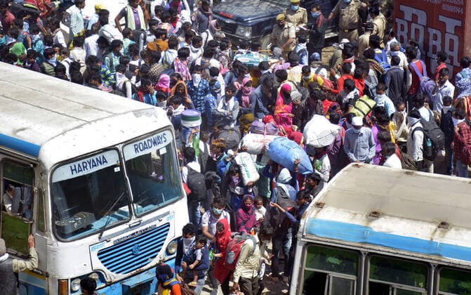 GHAZIABAD, INDIA - MARCH 29: An aerial view of the Lal Kuan bus stand where migrant workers are seen heading to their native state on buses arranged by the Uttar Pradesh government, on Day 5 of the 21 day nationwide lockdown imposed by PM Narendra Modi to curb the spread of coronavirus, on March 29, 2020 in Ghaziabad, India. (Photo by Sakib Ali Hindustan Times ) Migrant Workers Head Home In Coronavirus Lockdown