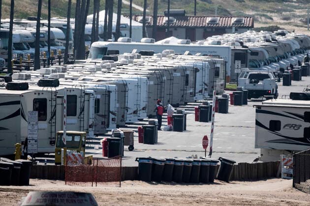March 29, 2020, Los Angeles, California, U.S: Workers in RV s park at Dockweiler State Beach, in an area being used as an isolation zone for those who cannot self-isolate and are being asked to quarantine by the Los Angeles County Department of Health, amid the coronavirus pandemic on Sunday March 29, 2020 in Los Angeles, California. Los Angeles U.S. - ZUMAc68_ 20200329_zaf_c68_016 Copyright: xRingoxChiux