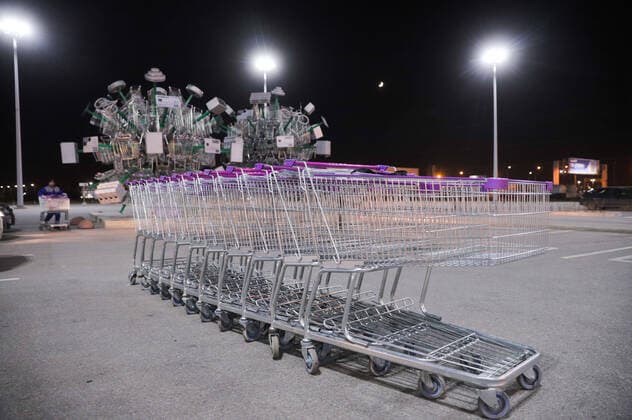 March 29, 2020, Saint Petersburg, Russia: Empty Shopping trolleys are parked near art installation called Virus of shopping at a parking of hypermarket..Art installation Virus of Shopping was installed to mark the official opening of hypermarket. At least 1534 cases of coronavirus and 9 death have been confirmed in Russia. Saint Petersburg Russia - ZUMAs197 20200329_zaa_s197_132 Copyright: xSergeixMikhailichenkox