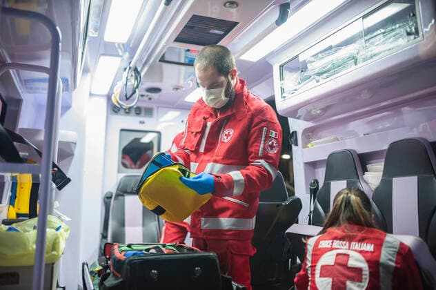 March 27, 2020, Milan, Italy: A member of the Red Cross seen preparing a bag in an ambulance. ..Due to the Covid-19 emergency, the Crisis Unit of the Red Cross Committee provide help to the citizens who need assistance in several municipalities, they offer commissions like food and medical supply, deliveries of prepared meals in hospitals, and ambulance services. Milan Italy - ZUMAs197 20200327_zaa_s197_167 Copyright: xValeriaxFerrarox