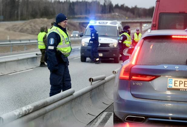 Police checks documents in the morning at a traffic control post in Lohja, Finland on March 30, 2020. The Finnish Government has decided to restrict traffic between the Region of Uusimaa and other regions to prevent coronavirus infections and to slow the spread of the epidemic in Finland. Lohja Finland  Copyright: xJussixNukarix LKLAPJ20200330062649Z290