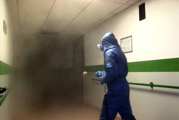 LOMBARDY, ITALY - MARCH 30, 2020: A brigade of Russian epidemiologists and experts of the Troops of Radiological, Chemical and Biological Defence of the Russian Defence Ministry together with Italian military specialists carry out a full disinfection of the Casa Serena residence for senior citizens in the town of Leffe, the province of Bergamo. Video screen grab. Russian Defence Ministry TASS  TS0D3D91