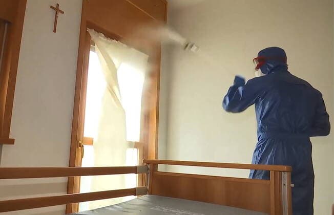 LOMBARDY, ITALY - MARCH 30, 2020: A brigade of Russian epidemiologists and experts of the Troops of Radiological, Chemical and Biological Defence of the Russian Defence Ministry together with Italian military specialists carry out a full disinfection of the Casa Serena residence for senior citizens in the town of Leffe, the province of Bergamo. Video screen grab. Russian Defence Ministry TASS  TS0D3D92