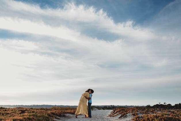 Wide view of mother and son on beach against cloudy blue sky San Diego, CA, United States ,model released, Symbolfoto CR_KESM200227-263929-01