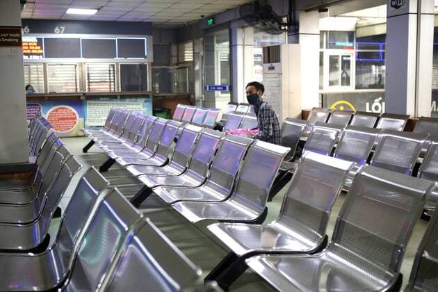 (200330) -- HANOI, March 30, 2020 (Xinhua) -- A passenger sits in an empty bus station in Hanoi, Vietnam on March 30, 2020. Vietnam s Ministry of Health Monday evening confirmed nine more COVID-19 cases, bringing the total in the country to 203. (VNA Handout via Xinhua) VIETNAM-COVID-19-NEW CASES 