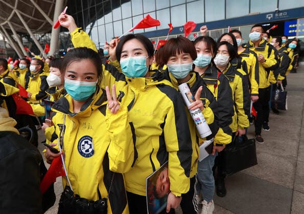 (200330) -- WUHAN, March 30, 2020 -- Medical workers prepare to board the train at Wuhan Railway Station in Wuhan, central China s Hubei Province, March 30, 2020. A total of 132 medical workers from the Third Xiangya Hospital of Central South University in Hunan left Wuhan on Monday after finishing their task. (Photo by Xinhua) CHINA-WUHAN-COVID-19-MEDICS FROM HUNAN PROVINCE-DEPARTURE (CN) ZhaoxJun 