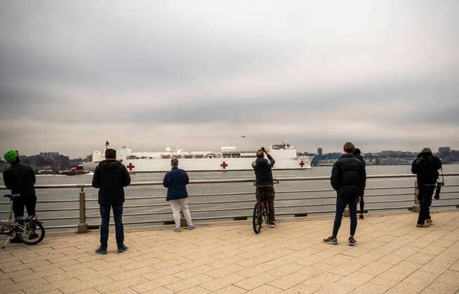 New York during the COVID-19 pandemic Visitors to Hudson River Park in New York greet the USNS Comfort hospital ship as it arrives in New York on Monday, March 30, 2020. The ship will berth at Pier 90 and use its 1,000 hospital beds to serve non-COVID-19 patients taken some of the burden off of New York hospitals. (  RichardxB.xLevine