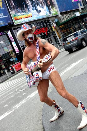 March 30, 2020, New York City, New York, US: In the city that never sleeps and at the Crossroads of the World, a magnet that is Times Square, indications of life is to been seen. Pictured is Robert John Burck better known as the Naked Cowboy, an American actor, singer, songwriter, writer and street performer in an empty Times Square. New York City US - ZUMAl135 20200330_zap_l135_024 Copyright: xG.xRonaldxLopezx