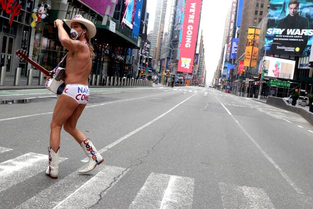 March 30, 2020, New York City, New York, US: In the city that never sleeps and at the Crossroads of the World, a magnet that is Times Square, indications of life is to been seen. Pictured is Robert John Burck better known as the Naked Cowboy, an American actor, singer, songwriter, writer and street performer in an empty Times Square. New York City US - ZUMAl135 20200330_zap_l135_049 Copyright: xG.xRonaldxLopezx