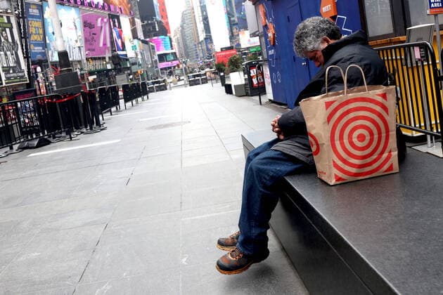 March 30, 2020, New York City, New York, US: In the city that never sleeps and at the Crossroads of the World, a magnet that is Times Square, indications of life is to been seen. Pictured is a homeless man at Duffy Square. New York City US - ZUMAl135 20200330_zap_l135_050 Copyright: xG.xRonaldxLopezx