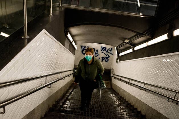 March 30, 2020, Barcelona, Catalonia, Spain: A woman wearing a protective face mask goes up stairs in the Barcelona metro. Daily coronavirus deaths fall slightly with 812 Covid-19 victims in the last 24 hours in Spain, Spanish government has ordered new lockdown restrictions. Barcelona Spain - ZUMAb137 20200330_zap_b137_013 Copyright: xJordixBoixareux