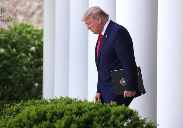 President Donald Trump walks into the Rose Garden to participate in a briefing on the coronavirus and COVID-19 pandemic, at the White House, in Washington, DC, on Monday March 2020.  WAX20200330307 MICHAELxREYNOLDS