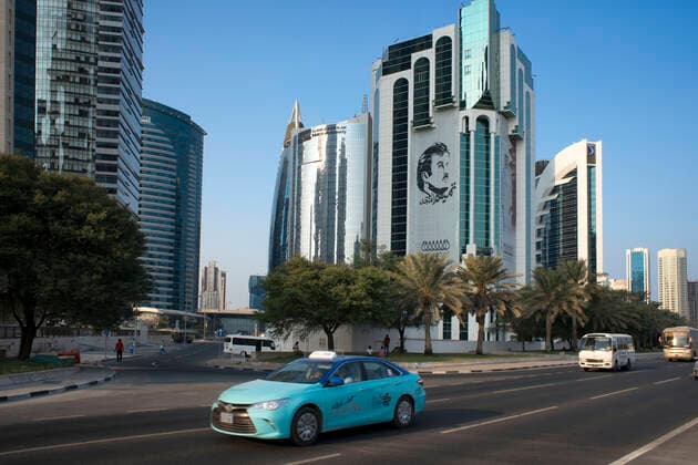 Taxi in Al Corniche street in the financial area of Doha, the capital of Qatar in the Arabian Gulf country Doha Qatar Copyright: xSergixReboredox SREB-Qatar 140