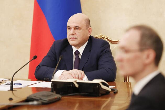 MOSCOW, RUSSIA - MARCH 31, 2020: Russia s Prime Minister Mikhail Mishustin during a meeting on economic issues at the House of the Russian Government. Pictured: Russia s Deputy Prime Minister - Russian Government Chief of Staff Dmitry Grigorenko (R). Dmitry Astakhov POOL TASS  TS0D3F32