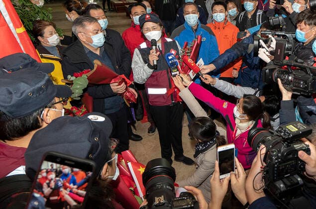 (200331) -- WUHAN, March 31, 2020 -- Li Lanjuan (C), a renowned Chinese epidemiologist, takes interview before leaving Wuhan, central China s Hubei Province, March 31, 2020. Medical staff leading by Li Lanjuan left Wuhan after finishing their task here on Tuesday. Li is an academician with the Chinese Academy of Engineering, who heads the State Key Laboratory for Diagnosis and Treatment of Infectious Diseases. ) CHINA-HUBEI-WUHAN-LI LANJUAN-MEDICAL STAFF-RETURN FROM HUBEI (CN) FeixMaohua 