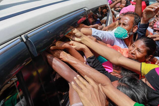 March 31, 2020, Dhaka, Bangladesh: People rushing cars to get financial aid during the nationwide lockdown imposed as a measure to prevent the spread of COVID-19, in Dhaka, Bangladesh, March 31, 2020. A nationwide lockdown is going on all over the country to curb the spread of the novel COVID-19 in the wake of five deaths and at least 51 infections. Dhaka Bangladesh - ZUMAd117 20200331_zap_d117_008 Copyright: xSuvraxKantixDasx