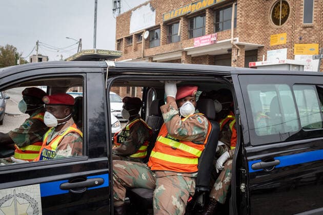 (200401) -- JOHANNESBURG, April 1, 2020 (Xinhua) -- Soldiers patrol on a street in a car in Johannesburg, South Africa, March 31, 2020. South African President Cyril Ramaphosa on Monday defended the 21-day national lockdown against the coronavirus pandemic which began on midnight Thursday, saying it is absolutely necessary. (Photo by Yeshiel Panchia Xinhua) SOUTH AFRICA-JOHANNESBURG-COVID-19 