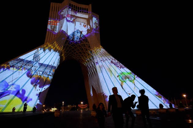 (200401) -- TEHRAN, April 1, 2020 -- The Azadi Tower is illuminated in Tehran, Iran, March 31, 2020. The Azadi Tower, a landmark monument in the Iranian capital of Tehran, was lit up here on Tuesday night as part of a ceremony showing support for people around the world in the face of the novel coronavirus outbreak. (Photo by Xinhua) IRAN-TEHRAN-COVID-19-AZADI TOWER-ILLUMINATION AhmadxHalabisaz 