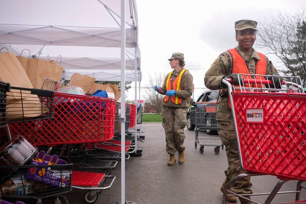 March 31, 2020, Columbus, Ohio, United States: Members of the Ohio National Guard help to pack food and supplies for those in need at the Mid Ohio Foodbank in Columbus..Due to the ongoing Coronavirus Pandemic and rising unemployment, the demand placed on Foodbanks around the United States has grown rapidly. The National Guard has been deployed to assist with the stocking, packaging, and distribution of food throughout the state. Columbus United States - ZUMAs197 20200331_zaa_s197_114 Copyright: xMatthewxHatcherx