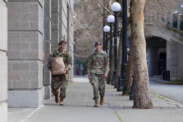 March 31, 2020, Seattle, Washington, U.S: Soldiers arrive with supplies the field hospital in CenturyLink Field Event Center in Seattle, Washington on March 31, 2020. Soldiers from the 627th Army Hospital at Fort Carson, Colorado are deploying a field hospital for non-COVID-19 cases that will house 150 beds when completed. Seattle U.S. - ZUMAg235 20200331_zap_g235_013 Copyright: xPaulxChristianxGordonx
