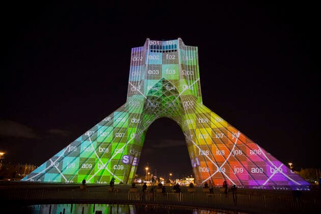 March 31, 2020, Tehran, Iran: A view at night of the lit-up Azadi (Freedom) tower with flags, messages of sympathy from all over the world over the ongoing novel coronavirus disease (COVID-19) pandemic, in Tehran, Iran. The appreciation message was also reflected in healthcare professionals who are trying to stop the pandemic in the country. The light display was organized by the city municipality. According to the latest reports by the Iranian Ministry of Health, over 2,000 people have died from the coronavirus infection throughout the country. Tehran Iran - ZUMAf146 20200331_zip_f146_015 Copyright: xRouzbehxFouladix