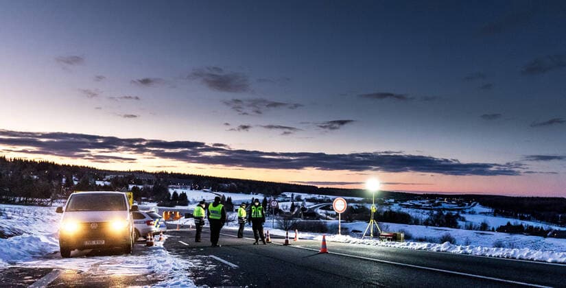 Czech policemen stand on a road at the Czech-German border for entry control in Cinovec, Czech Republic, March 31, 2020. (CTKxPhoto VojtechxHajek) CTKPhotoP202004010238501 HAJ 2