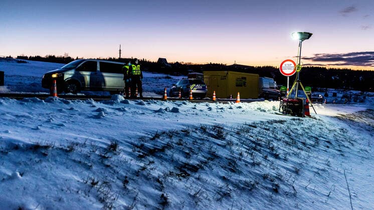 Czech policemen stand on a road at the Czech-German border for entry control in Cinovec, Czech Republic, March 31, 2020. (CTKxPhoto VojtechxHajek) CTKPhotoP202004010247501 HAJ 4