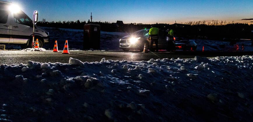 Czech policemen stand on a road at the Czech-German border for entry control in Cinovec, Czech Republic, March 31, 2020. (CTKxPhoto VojtechxHajek) CTKPhotoP202004010250701 HAJ 7