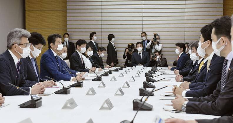 New coronavirus Japanese Prime Minister Shinzo Abe (3rd from L) attends a meeting of the government s coronavirus task force on April 1, 2020, in Tokyo. 