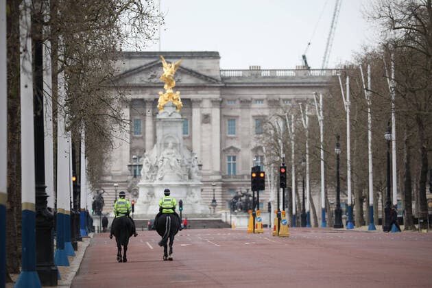 Day Nine of Lockdown in London. Mounted police offices patrol an almost deserted The Mall, with Buckingham Palace in the background. The country is on lockdown due to the COVID-19 Coronavirus pandemic. People are not allowed to leave home except for minimal food shopping, medical treatment, exercise - once a day, and essential work. COVID-19 Coronavirus lockdown, London, UK, on April 1, 2020 