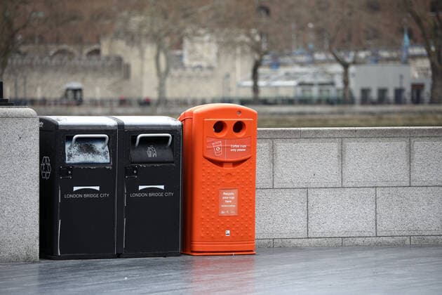 Day Nine of Lockdown in London. An orange dustbin for coffee cups only looks like it is smiling. The country is on lockdown due to the COVID-19 Coronavirus pandemic. People are not allowed to leave home except for minimal food shopping, medical treatment, exercise - once a day, and essential work. COVID-19 Coronavirus lockdown, London, UK, on April 1, 2020 