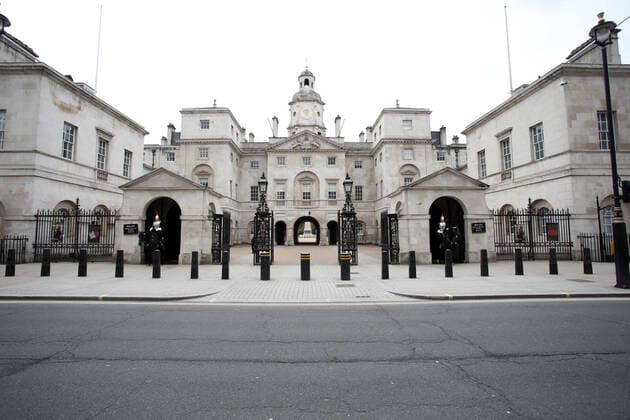 Day Nine of Lockdown in London. Whitehall road is deserted as Soldiers of the Household Cavalry guard the entrance to the Horse Guards Parade. The country is on lockdown due to the COVID-19 Coronavirus pandemic. People are not allowed to leave home except for minimal food shopping, medical treatment, exercise - once a day, and essential work. COVID-19 Coronavirus lockdown, London, UK, on April 1, 2020 