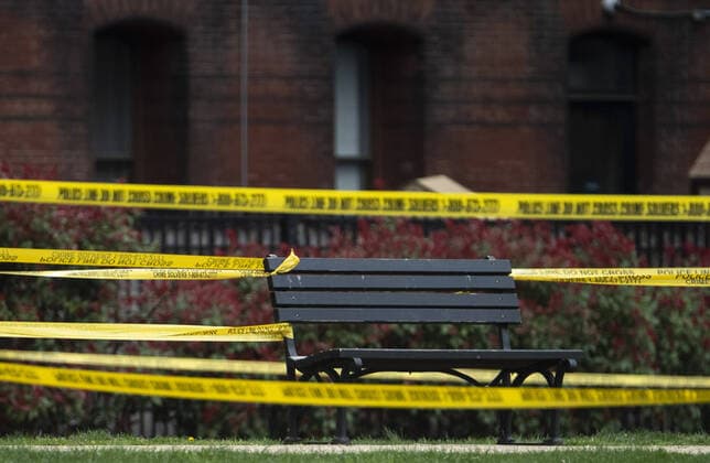 A park bench is sectioned off to the public on the National Mall as the DC Government issues a stay at home order to help combat the Coronavirus, COVID-19, pandemic, in Washington, D.C. on Wednesday, April 1, 2020.  WAP20200401308 KEVINxDIETSCH
