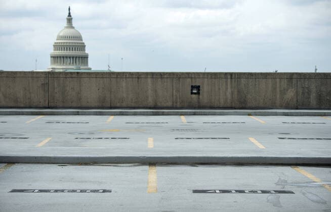 Empty parking spaces are seen at Union Station after the DC Government issues a stay at home order to help combat the spread of the Coronavirus, COVID-19, pandemic, in Washington, D.C. on Wednesday, April 1, 2020.  WAP20200401319 KEVINxDIETSCH