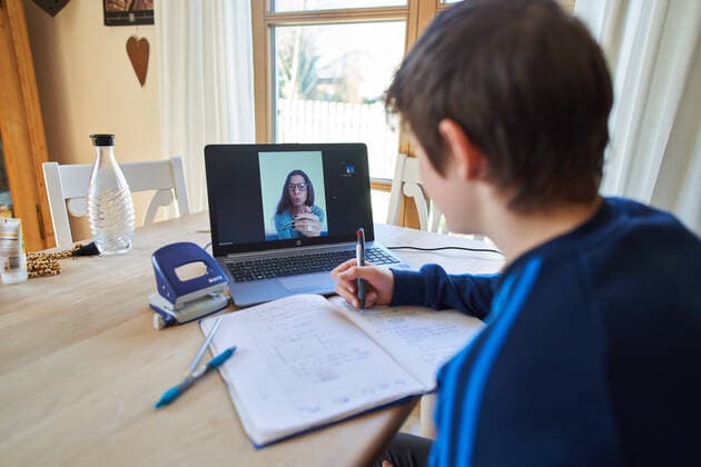 Kaufbeuren, Germany, April 01, 2020. Students are learning at home with computer and iphone due to the Corona virus disease (COVID-19) on April 01, 2020 in Kaufbeuren, Germany Model released