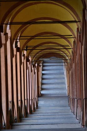 (200401) -- BOLOGNA, April 1, 2020 (Xinhua) -- The Portico di San Luca is seen empty in Bologna, Italy, on April 1, 2020. Italy registered a total of 110,574 COVID-19 cases as of Wednesday, and the death toll stood at 13,155, according to fresh figures released by the country s Civil Protection Department managing the national emergency response. (Photo by Gianni Schicchi Xinhua) ITALY-BOLOGNA-COVID-19-CASES 