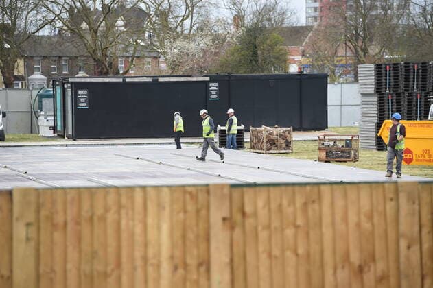 . 02 04 2020. London, United Kingdom. Coronavirus crisis. Builders seen carrying works for the new mortuary on the site owned by the City of London Corporation. A new mortuary for coronavirus victims, is been building on forest land next to the City of London Cemetery and Crematorium and is expected to take the dead from the new Nightingale Hospital at the ExCel Centre.  xGustavoxValientex xi-Imagesx IIM-20974-0002