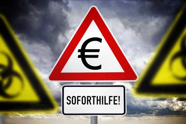 FOTOMONTAGE, Schild mit Eurozeichen und Schriftzug Soforthilfe, Symbolfoto Corona-Hilfe