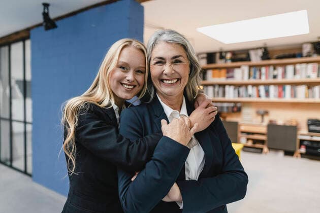 Portait of happy mature and young businesswoman in loft office model released Symbolfoto property released  GUSF03407