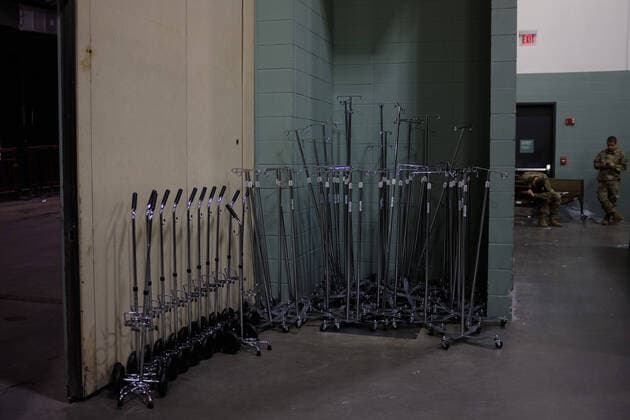 April 2, 2020, Worcester, Massachusetts, US: The Massachusetts National Guard in cooperation with FEMA and Umass Memorial Medical Cenetr are building a COVID-19, Corona Virus, field hospital to treat midlly ill paitents at the DCU Center in Worcester, Massachusetts. The facility will have 250 beds for those who are too sick to be home, but not in need of an Intensive Care Unit. Oxygen holders, and IV poles wait to be used. Worcester US - ZUMAd211 20200402_zap_d211_009 Copyright: xAllisonxDinnerx