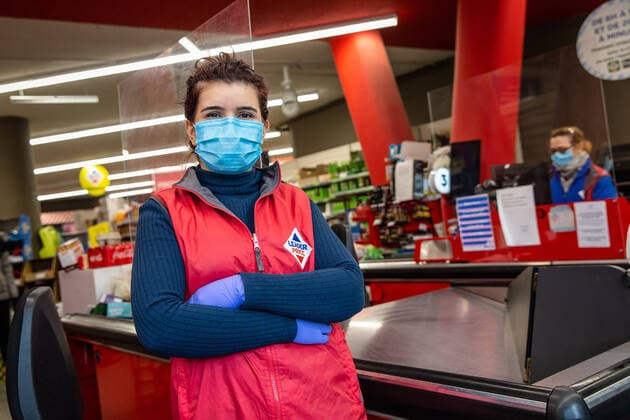(200403) -- PARIS, April 3, 2020 (Xinhua) -- A cashier wearing a protective mask poses for a photo at a supermarket in Paris, France, April 2, 2020. French hospitals registered a one-day loss of 471 coronavirus patients, taking the total to 4,503, while some 900 dependant elder people living at nursing homes had died of the virus since the epidemic began, a health official said on Thursday. In total, 59,105 people had tested positive for the virus, up by 2,116 in one day, versus an increase of 4,861 on Wednesday, said Director General of Health Jerome Salomon at the daily conference on the epidemic. (Photo by Aurelien Morissard Xinhua) FRANCE-PARIS-COVID-19 