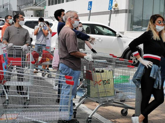 (200403) -- TEL AVIV, April 3, 2020 (Xinhua) -- Citizens wearing face masks are seen outside a supermarket in the central Israeli city of Tel Aviv on April 2, 2020. Israel reported 765 new confirmed cases of COVID-19 on Thursday, the daily highest so far, bringing the total number to 6,857, said the Ministry of Health. (Gideon Markowicz JINI Handout via Xinhua) MIDEAST-TEL AVIV-COVID-19 