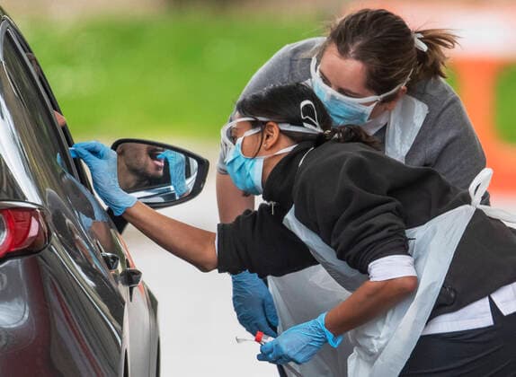 . 02 04 2020. Chessington, United Kingdom. National Health Service staff at work at a drive through Coronavirus Testing Centre in Chessington, United Kingdom.  xi-Imagesx IIM-20976-0045